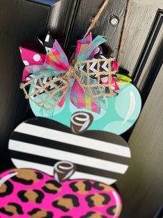 a door hanger decorated with an animal print heart