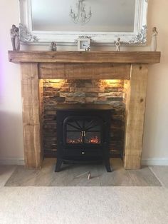 a fire place with a mirror above it