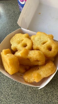 a box filled with fried food on top of a table