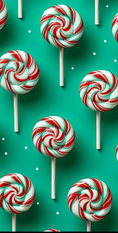 many red and white lollipops on a green background