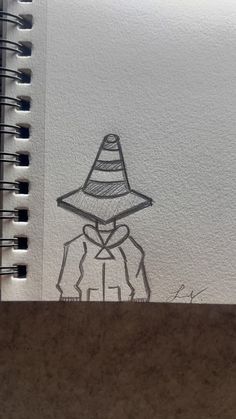 a drawing of a scarecrow wearing a hat on top of a paper with writing underneath it