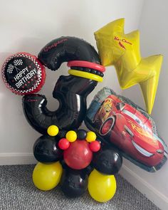 balloons and heliums are arranged in the shape of mickey mouse