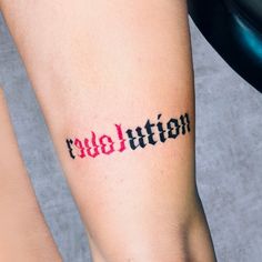 two people with tattoos on their legs and one has the word revolution tattooed on it