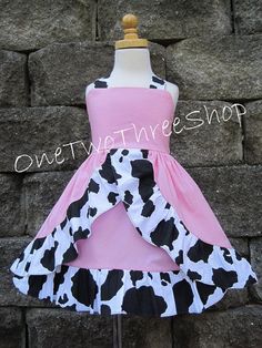 a dress made out of cow print fabric