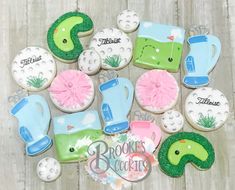 decorated cookies with golf related items displayed on wooden table top, including tee ball and mitt