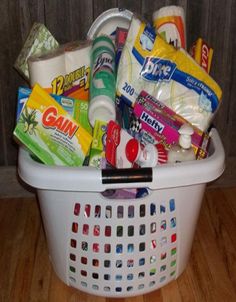 a white laundry basket filled with lots of toiletries