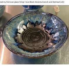 a blue bowl sitting on top of a metal counter