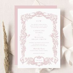 a pink and white wedding card with an ornate frame