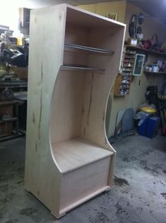 an unfinished wooden shelf in a garage