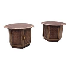 two wooden tables sitting next to each other on top of a white surface with one end covered in wicker