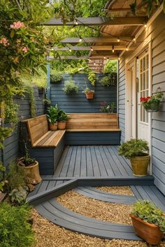 a wooden bench sitting on top of a patio next to a tree filled with potted plants