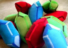 several brightly colored stuffed animals sitting on the floor