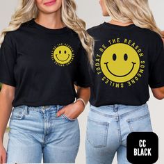 Front Pocket Smiley Face Comfort Colors Shirt - Spread Smiles Everywhere Brighten up someone's day with this adorable front pocket smiley face design! Our Be the reason someone smiles today shirt features a cheerful smiley face on the front pocket, guaranteed to bring a smile to anyone's face. The same delightful design is featured on the back of this Comfort Colors shirt, adding a touch of positivity wherever you go. Spread joy and happiness with this charming and comfortable shirt. HOW TO PLAC Cheap Trendy T-shirt With Smiley Face, Smiley Face Tshirt Ideas, Black Crew Neck Top With Smiley Face, Black Smiley Face Crew Neck Top, Black Smiley Face Crew Neck T-shirt, Black Crew Neck T-shirt With Smiley Face, Tom Brown, 1st Grade Teacher, Smiley Face Shirt