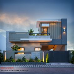 a modern house is lit up at night with lights on the windows and balconies