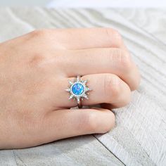 This 925 sterling silver ring features our original Sun motif paired with sustainable ocean blue opal and topaz. The sun has been a symbol of power, growth, health, passion, and life in many cultures throughout time. It is the life-force that enables all things to thrive and grow. Wear our sun jewelry to tap into your inner-strength. This stunning piece encapsulates the sun in all its beauty. The topaz gemstones shine like the rays of the sun and will brighten any day. Details: Brand: Alamea Mat Sun Motif, Sun Jewelry, Symbol Of Power, Sun Ring, Rays Of The Sun, Power Symbol, Life Force, Topaz Gemstone, Blue Opal