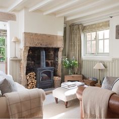 a living room filled with furniture and a fire place