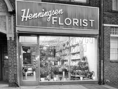 an old photo of a florist store front