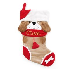 a christmas stocking with a dog wearing a santa hat and red ribbon on it