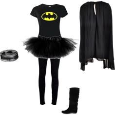 a woman is dressed up in black and has a bat costume on her shirt, leggings and boots