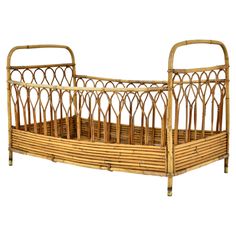 a baby crib made out of bamboo and wicker