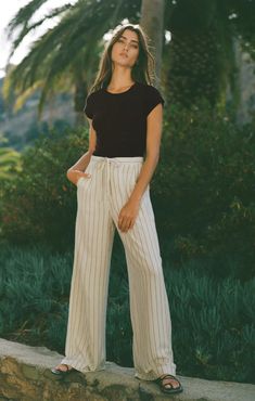 We're bringing pinstripes back this season with the casual chic Cortez Stripe Pant. Made of our breezy rayon linen fabric, this pant is perfect for all your warm weather adventures. Regular fit Yarn-Dyed Linen: 86% Rayon, 14% Linen Wide leg pant Button closure and zip fly Mid-weight woven Lined Machine Wash Cold, Hang To Dry, Warm Iron If Needed Pinstripe Pants, Dyed Linen, Wide Leg Linen Pants, Wide Leg Pant, Loungewear Sets, Pantalon Large, Linen Pants, Denim Top, Pants Outfit