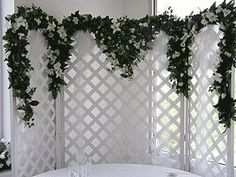 a white table and chairs with flowers on them