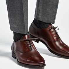 These classic brown Oxfords are crafted from supple calf leather in a flexible Blake stitch, and feature full leather lining and sole. Luxury Brown Oxfords With Goodyear Welt, Luxury Brown Goodyear Welted Oxfords, Elegant Cognac Oxfords With Goodyear Welt Construction, Brown Goodyear Welted Almond Toe Oxfords, Brown Goodyear Welted Cap Toe Dress Shoes, Business Cognac Oxfords With Goodyear Welt, Luxury Brown Cap Toe Oxfords, Fitted Leather Boots For Semi-formal Occasions, Classic Brown Dress Shoes With Goodyear Welt