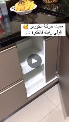 an open refrigerator in a kitchen with bananas on the counter