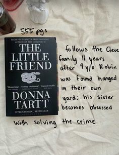 the little friend by donna tart with some writing on it