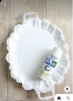 a white plate with a spray bottle on it