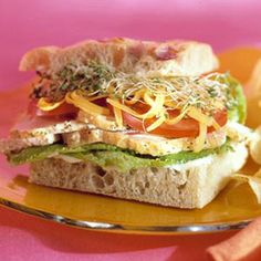 a sandwich and potato chips on a plate