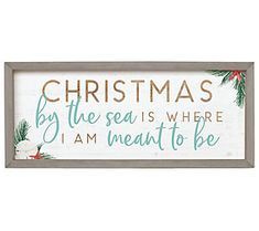 a wooden sign that says christmas by the sea is where i am meant to be