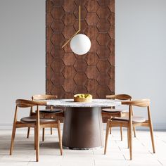 a dining room table with chairs and a large painting on the wall in the background