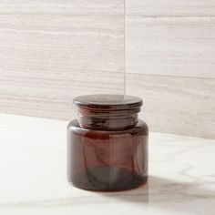 a brown jar sitting on top of a white counter