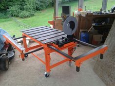 a machine that is sitting on top of a table in front of a man with a blue shirt