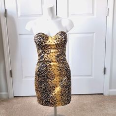 Never Worn. Size 2. Silk Fabric, Animal Pattern, Black And Gold, With Lining.. I Tried To Show The Back Zip But The Mannequin Is Too Wide So I Can't Zip It All The Way Up. Strapless Stretch Mini Dress, Guess Dress, All The Way Up, Tube Dress, Animal Pattern, Monster High, Silk Fabric, Black And Gold, I Tried