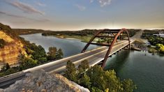 an aerial view of a bridge over a river