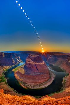 the sun is setting over some mountains and water in this photo, it looks like they are