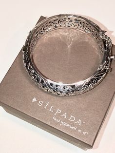 "B1829 Silpada Hinged Bangle Bracelet Silpada hinged sterling silver bangle bracelet with a box clasp and safety chain. Fits up to a 7 1/2\" wrist. New for $349 before the company went out of business. In excellent new condition, comes with a gift box and can be gift wrapped on request! GORGEOUS gift for you or your loved one! Silver Sisters After Party! Let's Keep the Silpada Party Going!" Luxury Hinged Bangle For Wedding, Formal Oxidized Bangle Cuff Bracelet, Elegant Oxidized Finish Cuff Bracelet For Formal Occasions, Elegant Oxidized Bangle, Elegant Oxidized Bangle Jewelry, White Gold Sterling Silver Bangle With Intricate Design, Formal Sterling Silver Bracelet With Intricate Design, Sterling Silver Formal Bracelet With Intricate Design, Ornate Hinged Bangle Bracelet