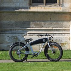 an electric bicycle parked in front of a building