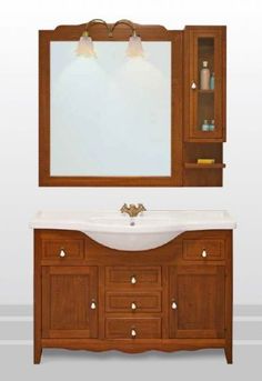 a bathroom vanity with a mirror above it and a sink under the counter top, in front of a wall mounted medicine cabinet