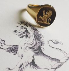 heavyweight classic oxford oval signet ring, ideal for larger gents sizes, 13x16mm oval, 3mm thick, extra thick shank, Quality hand engraving with over 35 years international award winning years experience. weight 9ct - 12grams 14ct - 14.5grams 18ct - 16grams This listing offers free hand engraved family crest or monogram (initials) Creating a Signet Ring 1. We start by stamping the ring from a solid gold metal plate.This is ideal for engraving as it leaves a perfectly flat surface. 2. Our skill Heirloom Oval Signet Ring With Coat Of Arms, Gold Oval Signet Ring With Coat Of Arms, Classic Oval Signet Ring With Coat Of Arms, Elegant Oval Signet Ring With Coat Of Arms, Oval Signet Ring, Gold Bullion Coins, Gold Bullion, Gold Signet Ring, Family Crest