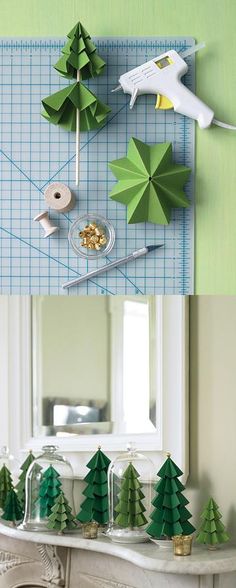 paper trees are arranged on the mantle in front of a mirror