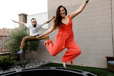 a man and woman jumping in the air