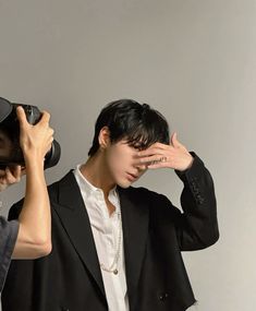 two people with hats covering their eyes