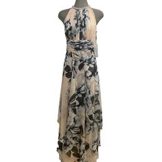 This Stunning Calvin Klein Dress Features A Beautiful Blossom Floral Pattern With Rhinestone Accents Halter Neckline. The Dress Is Made Of Lightweight Chiffon Fabric And Has A Hidden Back Zipper For A Seamless Look. The Tiered Gown Falls To A Long Length, Making It Perfect For Any Formal Occasion Or Even A Summer Party. The Dress Is Available In Size 4 And Is Not Vintage. It Can Be Hand Washed In Cold Water, But Dry Cleaning Is Recommended. The Dress Embodies The Theme Of Flowers And Is Perfect Elegant Chiffon Gown With Floral Print, Elegant Floral Chiffon Gown, Chiffon Floral Print Evening Dress, Fitted Chiffon Gown For Spring, Elegant Calvin Klein Floral Print Dress, Calvin Klein Cocktail Dress For Spring, Fitted Calvin Klein Maxi Dress For Evening, Elegant Calvin Klein Maxi Dress For Party, Elegant Calvin Klein Evening Maxi Dress