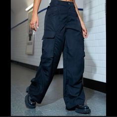 These Are Wide Leg Cargo Pants With Side Pockets. Size Small. Very 90s Vibe, Perfect On The Waste But Baggy In The Right Places. I Would Describe Them As Comfy Parachute Style Pants. Totally Punk Rock Perfection! Never Worn Just Tried On For Size. Y2k Straight Pants With Pockets, Non-stretch Y2k Style Streetwear Pants, Non-stretch High Waist Bottoms For Streetwear, High-waist Non-stretch Streetwear Bottoms, Non-stretch Bottoms With Cargo Pockets For Streetwear, Y2k Straight Pants With Cargo Pockets, 90s Style Baggy High Waist Bottoms, 90s Baggy High Waist Bottoms, Y2k Style Straight Cargo Pants With Pockets