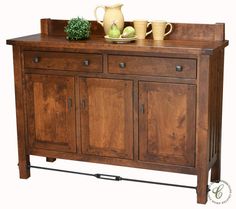 a wooden cabinet with two vases and an apple on top