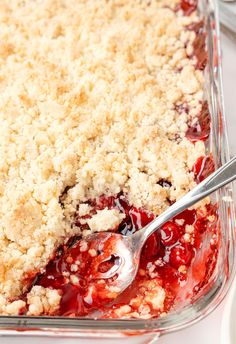 a close up of a pie in a pan with a spoon