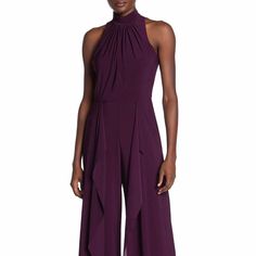 A Super Cute Wide Leg Jumpsuit From Marina! There’s Ruffle On The Legs Which Makes The Wide Leg Jumpsuit More Flowy! It Runs Small.. So Sad It Doesn’t Fit Me! Otherwise I Would Totally Keep It!! Back Zip With Hook. Lined. Size 8 - Runs Small. Fits Us 4 - 6 Dark Plum Color. Color Looks Like The One In The Second Picture. New With Tag! Leave Comments For More Details Since The Pictures Can’t Do It Justice! Sleeveless Ruffled Jumpsuits For Formal Occasions, Sleeveless Ruffled Jumpsuits And Rompers For Night Out, Formal Sleeveless Ruffled Jumpsuits And Rompers, Formal Sleeveless Ruffled Jumpsuit, Fitted Sleeveless Jumpsuit With Ruffles, Elegant Sleeveless Ruffled Jumpsuits And Rompers, Black Dressy Jumpsuit, Black Sleeveless Jumpsuit, Chiffon Jumpsuit